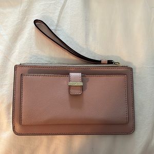 pink kate spade wrist purse with cardholder on the front